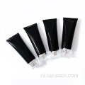 Zwarte plastic fles aangepaste lege roomlotionbuis
